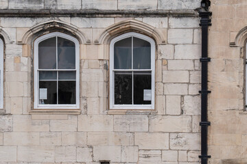 Fototapeta premium Ancient medieval stone window in an old European castle wall