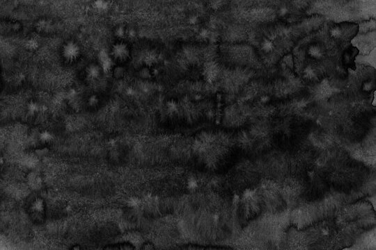 Closeup texture of rough dark stone surface with natural irregular patterns and subtle variations