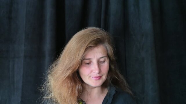 Portrait of a woman on a black background,