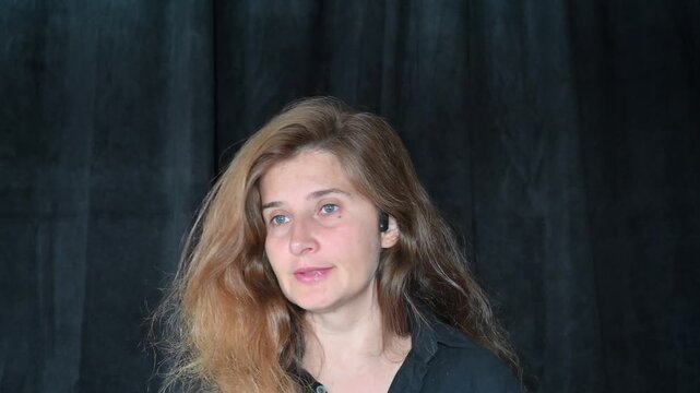 Portrait of a woman on a black background,