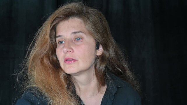 Portrait of a woman on a black background,