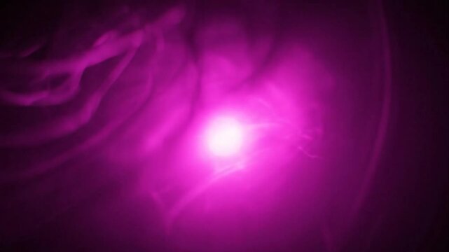 Purple Light Shining Brightly in Space.