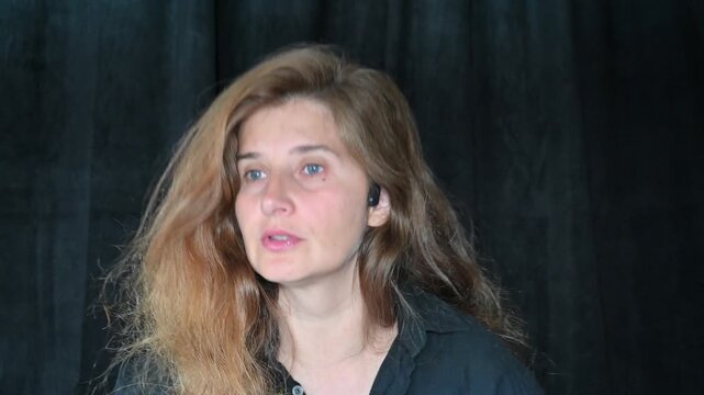 Portrait of a woman on a black background,