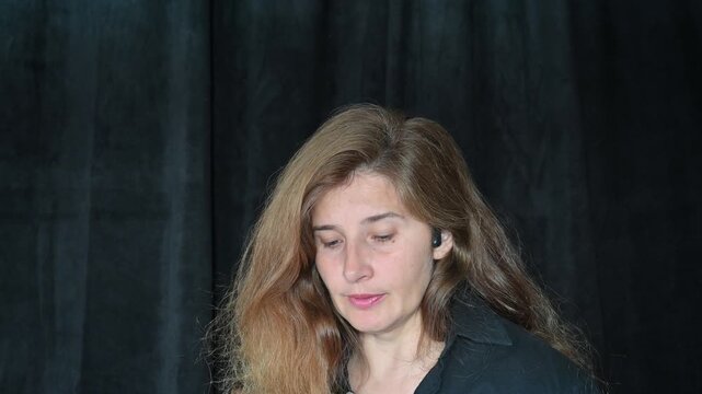Portrait of a woman on a black background,