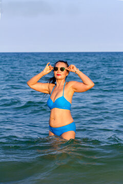 Woman body sexy in blue bikini relax on beach
