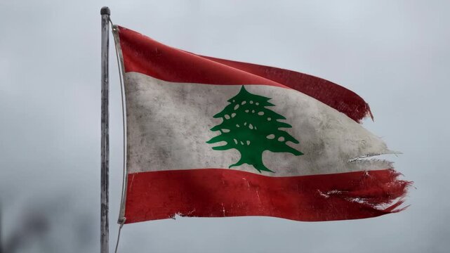 Lebanese flag flutters in three key frames. Red edges fray with visible tears. White stripe shows worn patches. Green cedar emblem stays distinct. Overcast sky adds somber mood