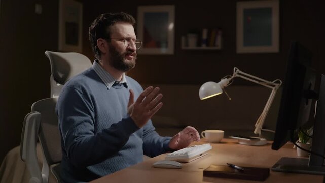 Frustrated freelancer, failure. Man working on computer is upset by what he sees on screen