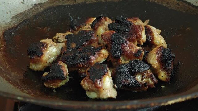 The pork was burnt in the pan.The pork was burnt in the pan.