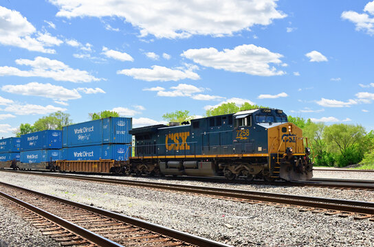 A single CSX Transportation locomotive leads a stack train destined for an intermodal terminal in Chicago's southwestern suburbs.