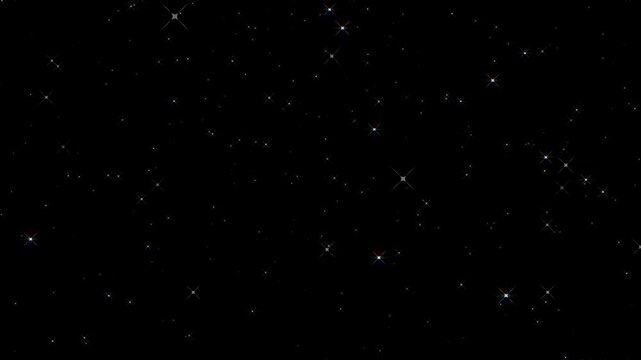 Sparkling particles overlay with magical glittering stars and glowing multi color lens flare effect over a dark black screen background for celebration festive wedding backdrop abstract video loop. 4k