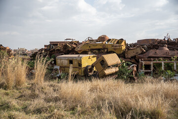Fototapeta premium Pile of old trucks and military equipment at the tank graveyard on the outskirts of Asmara, Eritrea