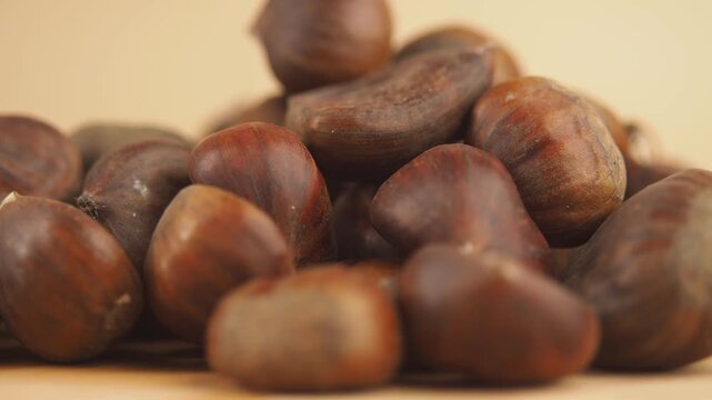 closeup of chestnuts on a color background