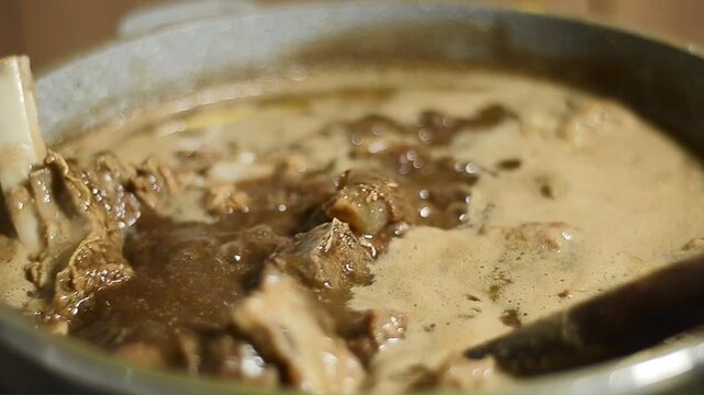 Tender beef ribs immersed in aromatic konro soup, a popular Indonesian dish known for its rich savory flavor.