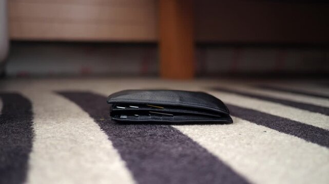 Wallet found on the rug near the wooden table. lost wallet concept