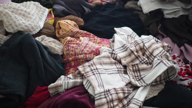 Sorting clothes for donation at home in the morning