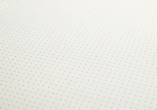 Seamless pattern of small grey dots on a white background