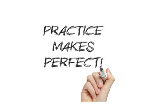 Hand writing 'practice makes perfect' with marker on whiteboard background
