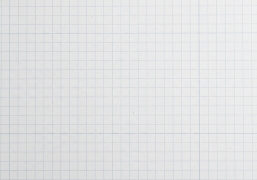 Closeup of a blank white graph paper sheet with blue grid lines
