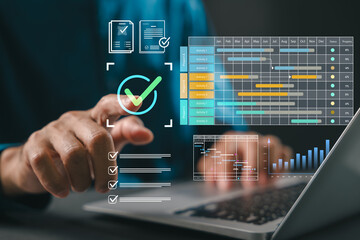 Fototapeta na wymiar Project manager plans work using Gantt chart schedule, utilizes dashboard for corporate timeline, shows deliverables on laptop screen, hand touches checkmark for business productivity