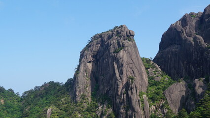 Fototapeta premium Exploring the Legendary Peaks and Pines in Mount Huangshan and the famous Guest-Greeting Pine in China