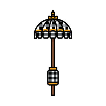 Traditional balinese ceremonial umbrella with checkered pattern