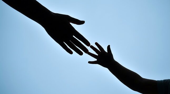 Silhouette of adult and child hands reaching for each other