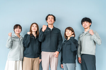 Fototapeta premium Employees and staff (businessmen and businesswomen) wearing work clothes at small and medium-sized enterprises such as factories and construction companies.