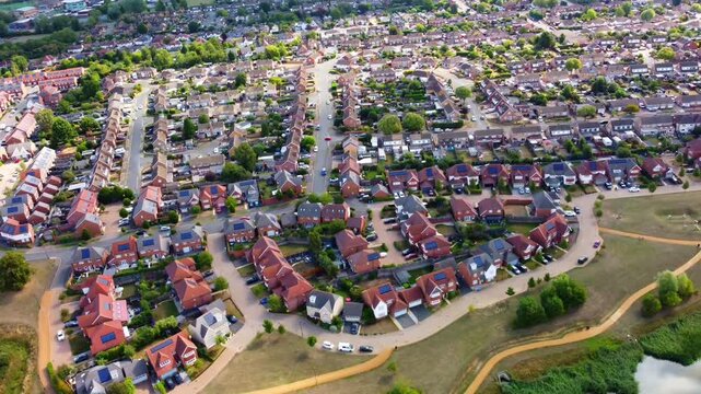 Aerial View Of Barton Seagrave Kettering  With Detached Houses, Gardens And Curving Streets In Summer Light
