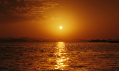 Fototapeta premium Dramatic Sunset Over Tranquil Coastal Horizon
