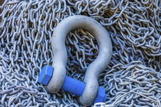 Steel eyelet with screw bolt and chain in Portofino harbour, Portofino, Liguria, Italy