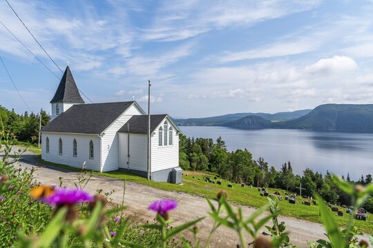 White wooden St Ambrose Church overlooking the Atlantic Ocean, Corner Brook, Bay of Islands, Newfoundland, Canada