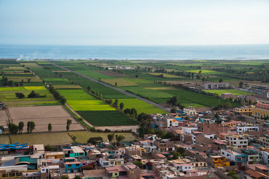 Panoramic view of the green Tambo Valley stretching to the Pacific Ocean in Islay, Arequipa, Peru