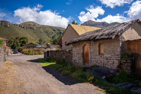 Traditional rustic stone house with a thatched roof in the rural village of Coporaque, Colca Valley, Peru