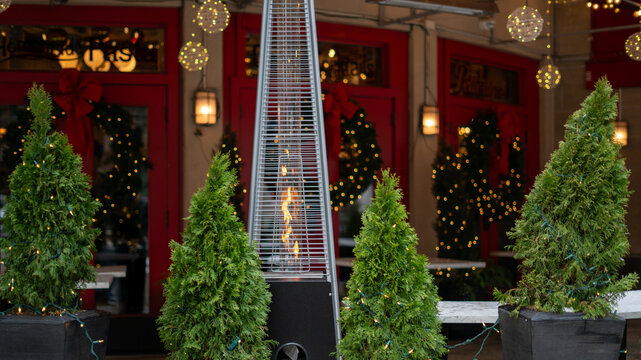 Outdoor Flame Heater with Christmas Decorations Outside a Downtown Chicago Restaurant