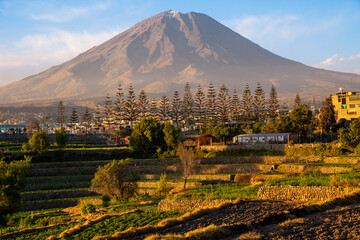 Panoramic sunset view of Misti volcano behind ancient agricultural terraces in Paucarpata, Arequipa, Peru © Helard