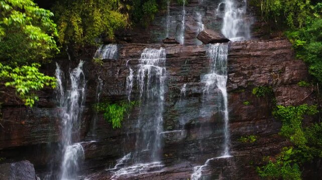 Dabdabe Falls or Jhari Waterfall with trees and steep rocks at Attigundi, Dattatreya Peeta, Chikmagalur, Karnataka, india. day time, zib shot, push back shot, drone shot, 4k.