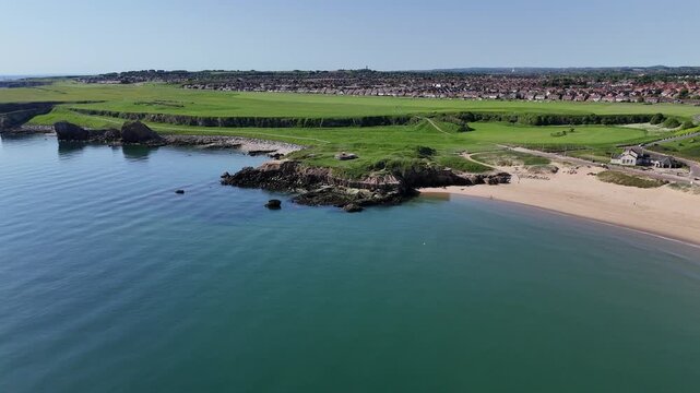 Drone View of Rocky South Shields Coastline with Green Clifftop and Sea
