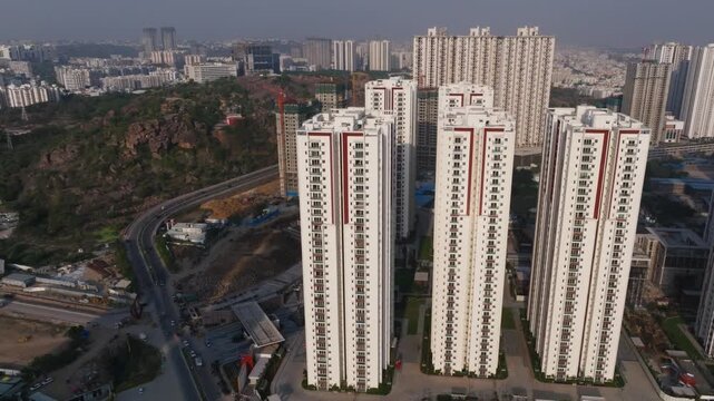 Aparna Zenon apartments with ORR service road and SRI ANANTHA PADMANABHA SWAMY VARI Temple at khajaguda, narsingi, hyderabad, telangana, india. day time, trucking shot, drone shot, 4k.