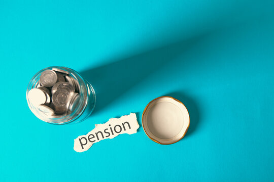Coins spilling out of a glass jar with the word PENSION