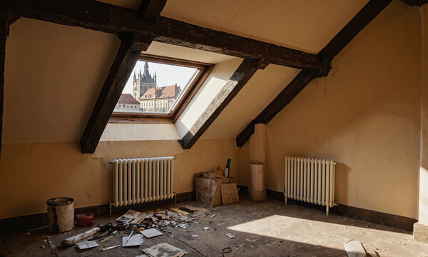 Attic skylight castle view from a rustic garret featuring sloped ceilings and exposed wooden beams overlooking a historic European city