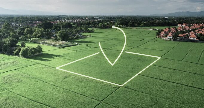 Aerial view of lush green rice field featuring land parcel with location marker, representing agricultural property, farmland investment or real estate for sale. Ideal for land development concepts.