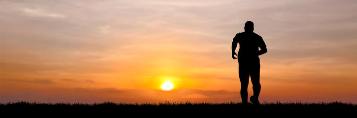 A lone runner silhouetted against a vibrant sunset, embodying dedication and the pursuit of health. The warm hues of the sky create a dramatic backdrop for this moment of personal triumph ©  2026stockx