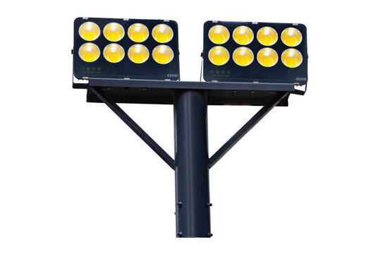 Large spotlight pole isolated on cutout PNG or transparent background. Technology that provides light in wide area. Beautifully shaped set in park to illuminate night. Safety on roads or park.