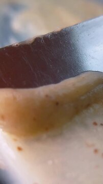 Close up view of natural moisturizing cream. Showing rich texture and thickness level. Skincare concept for healthy hydrated skin.