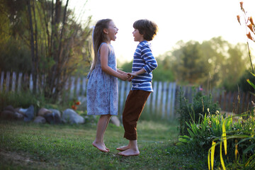 Children walk in the summer in nature. Child on a sunny spring morning in the park. Traveling with children. © alexkich