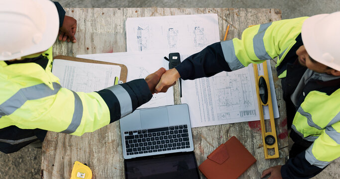 Construction, team and architect with handshake outdoor for site handover, legal closure or agreement. Architecture, above and men shaking hands for duty transfer, professional trust or cooperation