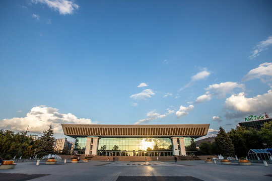 Wide view of the Palace of the Republic building with Kok Tobe sign on the right. Almaty, Kazakhstan - October 03, 2024