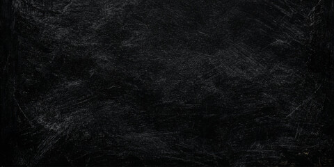 Black scratched chalkboard background texture with white marks and scratches for writing or drawing © Daiyan