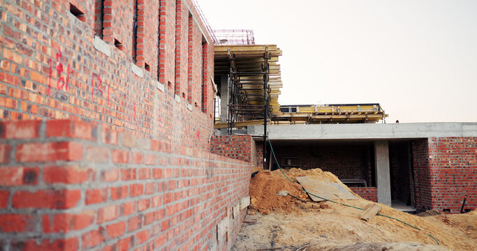 Material, house and real estate project for construction, development and home renovation. Property, brick wall and architecture with structure, building and suburban improvement or engineering