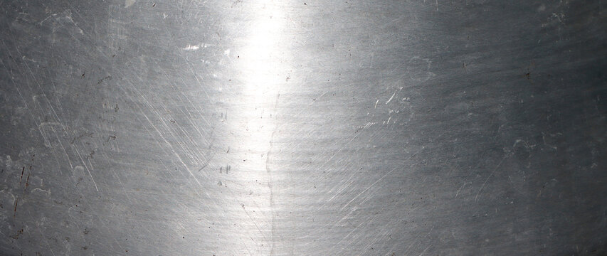 Brushed  aluminum metal texture background with scratched steel surface and industrial material pattern for design